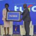 Hon Evelyn Anite (State Minister for Investment & Privatization) holds a plaque with Turaco Insurance GM Hamza Mutebi after Turaco officially became an insurance underwriter in Uganda.