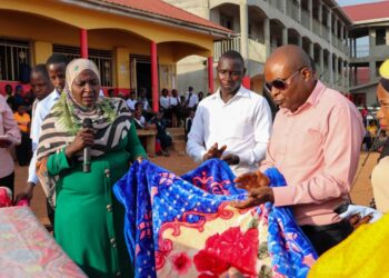 Hajjati Hadijjah Namyalo left while handing over Blankets and other accomodation materials to the management Excel of Vocational institute