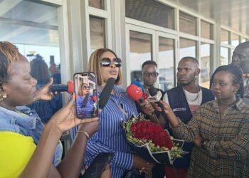 Sinach addressing the press on her arrival at Entebbe International Airport Kampala Uganda