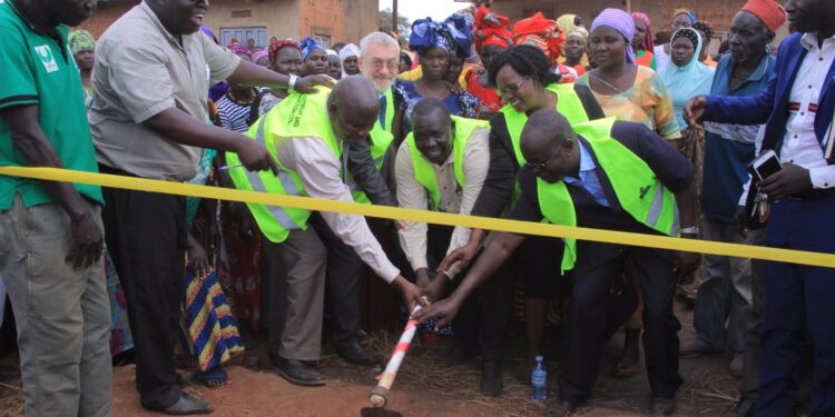 Officials from UNCDF and Yumbe district local leaders launch the Kuru market, in Kuru Town Council, Yumbe