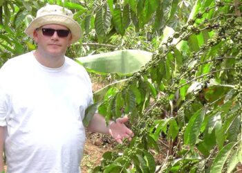 Louis Hurst, the founder of HatHats, pictured at a coffee bean plantation in Uganda. Photo@Gerry Warren