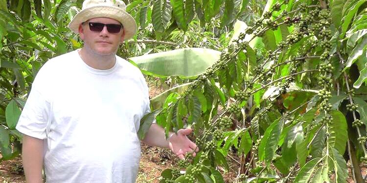 Louis Hurst, the founder of HatHats, pictured at a coffee bean plantation in Uganda. Photo@Gerry Warren