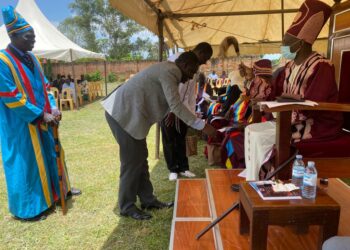 Tom Okao the Principal FIMAT greets and being blessed by the Lango Paramount Chief (Won Nyaci)Eng Dr Michael Moses Odongo Okune during a meeting on Friday 22 September, 2023 in Lira City.