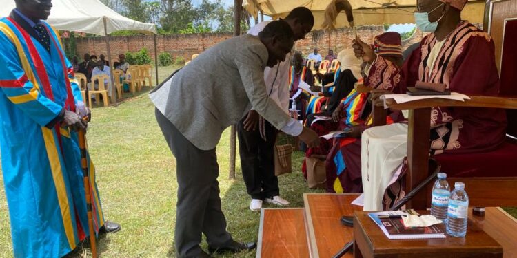 Tom Okao the Principal FIMAT greets and being blessed by the Lango Paramount Chief (Won Nyaci)Eng Dr Michael Moses Odongo Okune during a meeting on Friday 22 September, 2023 in Lira City.