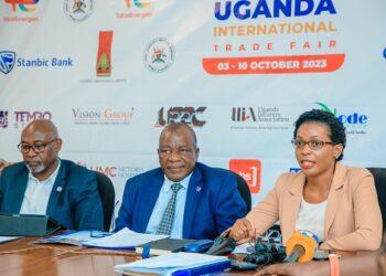 Macklean Kukundakwe (R), Head of Marketing at Uganda Baati, speaks at the media briefing for the 29th Uganda International Trade Fair 2023