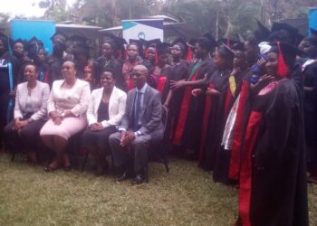 Minister Sarah Mateke (2nd Left) poses for a group photo with the graduand girls and their mentors at Fairway Hotel on Tuesday