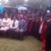 Minister Sarah Mateke (2nd Left) poses for a group photo with the graduand girls and their mentors at Fairway Hotel on Tuesday