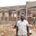 Mr Musaazi standing infront of the new home