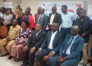 Prof. Ezra Suruma (3rd Right) is flanked by Parliamentary Forum for Social Protection members during the dialogue on Wednesday at Kampala Hotel Africana