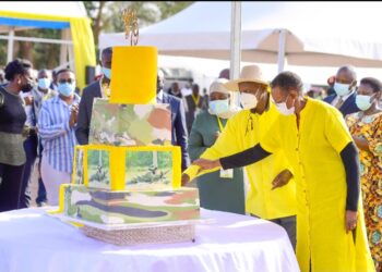 President Museveni and the First Lady Janet Museveni cutting the birthday cake