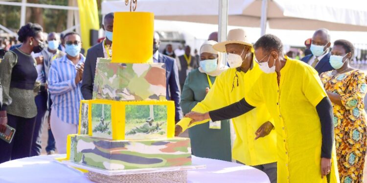 President Museveni and the First Lady Janet Museveni cutting the birthday cake