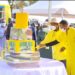 President Museveni and the First Lady Janet Museveni cutting the birthday cake