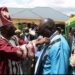 The Lango Paramount Chief(Won Nyaci)Eng. Dr Michael Moses Odongo Okune dresses one of the newly-installed clan chief(awitong)Willy Kagere Omodo-Omodo in a ceremony held at Akia in Lira City.