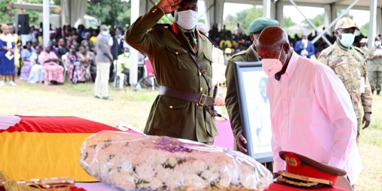 President Museveni paying respect to the body of the late Brig Gen Pierino Okoya