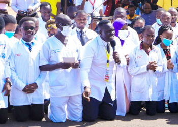 Dr. Samuel Oledo holding the microphone