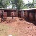 Goretti Tushiime joins the shamba boys to rebuild the paddocks that were destroyed by the Sunday heavy rains.