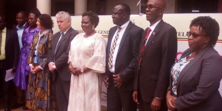 Minister Betty Amongi (Fifth right) is flanked by Ireland Ambassador and other officials during celebrations to mark the International Day for the Girl Child at the National Theatre in Kampala on Thursday