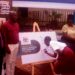 Minister of State for Sports Peter Ogwang(2nd Left) witnesses a girl child signing on a placard to launch Educate Her campaign at the Ministry of Education and Sports on Embassy House in Kampala on Friday