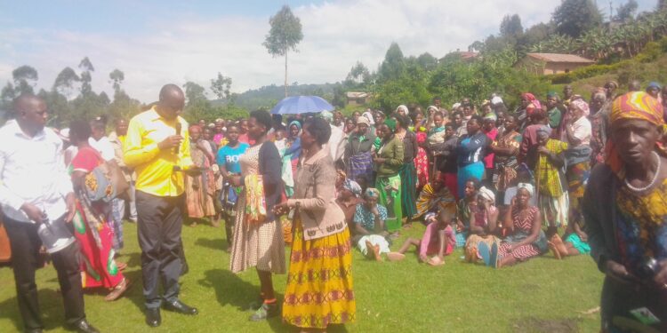 Those who turned up for the hoe distribution program being addressed by the minister Musasizi