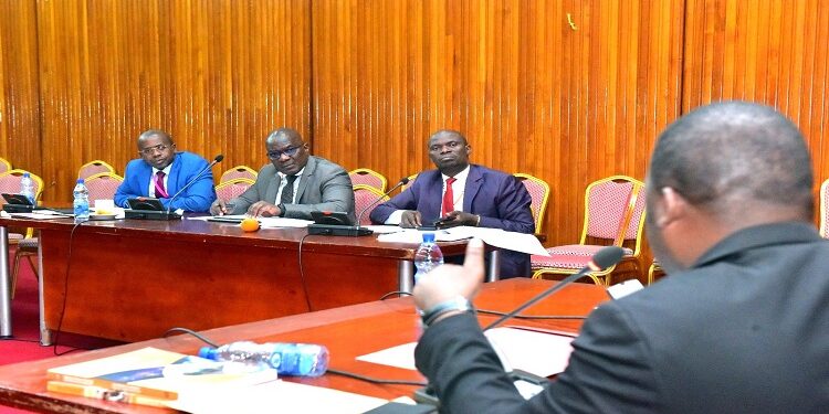 L-R: KCCA's Eng. Justus Akankwasa, Eng. Luyimbazi and Minister Kabuye interfacing with the committee at Parliament