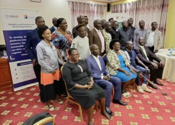 Karamoja Regional Development Initiative members are flanked by their regional members of parliament in a group photo at Kampala Hotel Africana on Thursday