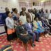 Karamoja Regional Development Initiative members are flanked by their regional members of parliament in a group photo at Kampala Hotel Africana on Thursday