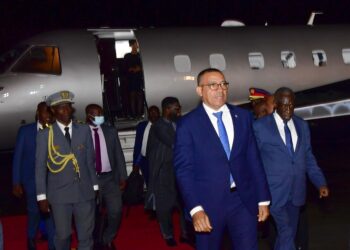 President Carlos Manuel of Sao Tome and Principe chats with ESO Director General Amb Joseph Ocwet on his arrival at Entebbe International Airport on Thursday morning. PPU Photo
