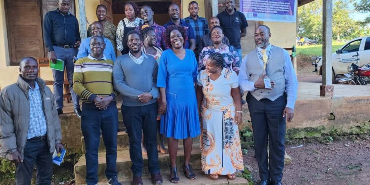 RGIL implementing partners gather for a photo with Leaders of Gomba District Local Government at Nakyegonza Subcounty headquarters, Gomba district