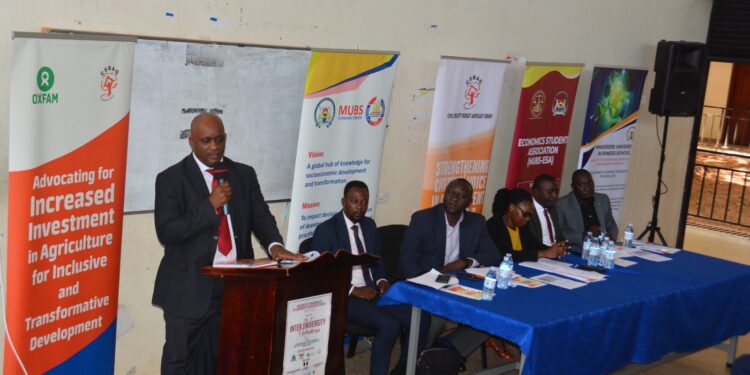 CSBAG Executive Director Julius Mukunda addressing participants at the Renewal Energy Financing at MUBS on Friday