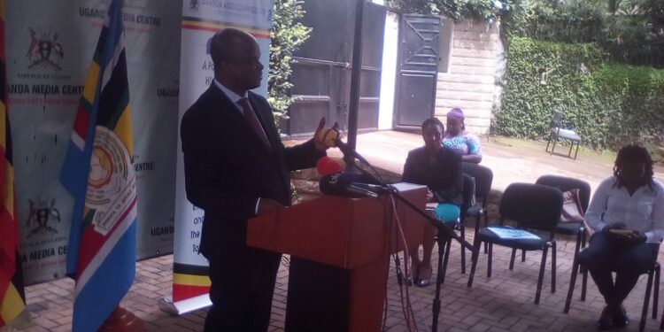 Dr. Nelson Musoba, Uganda Aids Commission Director General addressing Journalists at the Uganda Media Centre on Tuesday