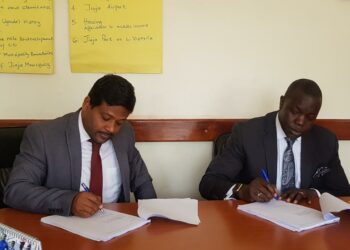 Ediga Udai Kanth - Africa head for Dataset Solutions and Sisto Ocanda Ondama, CEO Paramount Cities, USA signing the contract with Jinja City in 2020.