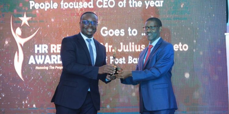 Julius Kakeeto the PostBank Uganda CEO receives the Award for Best People Focused CEO of the year 2023 during the recently concluded HR Reveal Awards at the Kampala Serena Hotel