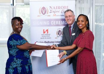 Partnership: Mukawa (Hotels) Holdings Ltd Directors Ms Clare Njeri Githunguri (left) and
Ms Lilian Joy Nyagaki Githunguri (right) exchange the hotel management agreements with
Swiss-Belhotel International’s Senior Vice President Laurent Voivenel (centre) at the signing
of a deal for the management of Nairobi Safari Club by the International hospitality group.
Following the signing, the four-star, all-suite hotel established in 1984 by the late Kenyan
Businessman and Member of Parliament, Honourable Stanley Munga Githunguri, will be
rebranded as Nairobi Safari Club by Swiss-Belhotel.