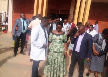 Dr Oledo speaking to Dr Diana Atwiine after a short meeting with health workers from Kigezi subregion at Kabale Regional Referral Hospital.