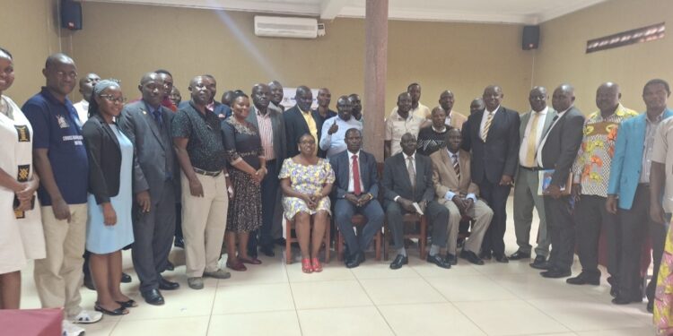 Minister Kyofatogabye in a group photo with officials from the Office of the President and Karamoja RDCs, RISOs and DISOs