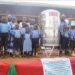 Kalerwe Parents School learners and other officials pose for a photo with the smart tank.