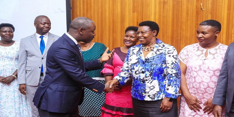 Tayebwa interacts with former MP and SACCO board member, Hon. Miria Matembe at the AGM