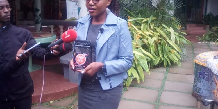 Ann Frida Nandutu, the CEO of Paradise Coffee Bugisu Cooperative adressing Journalists at Kampala Fairway Hotel on Tuesday