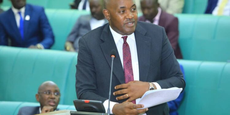 The Minister of Information, Communication Technology and National Guidance, Chris Baryomunsi on the Floor of the House on Wednesday, 06 December 2023