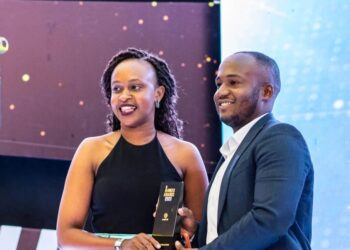 Airtel Money Lead Insurance, Faisal Namanya (R) receiving an award on behalf of AMCUL at the recently concluded 23 UMEA Awards at the Kampala Serena Hotel.  AMCUL received 2 awards for Best Use of Partnership and Best Innovation.