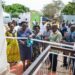 The State Minister For Northern Uganda, Hon. Grace Kwiyucwiny officially opens the UDB Northern Uganda Regional Office in Gulu City among other Government and UDB officials.