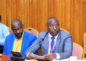 Mayors, Robert Kakyebezi (Mbarara City/left) and Sentaro Byamugisha (Kabale Municipality) appearing before the House Committee on Physical Infrastructure on Tuesday 12 December 2023