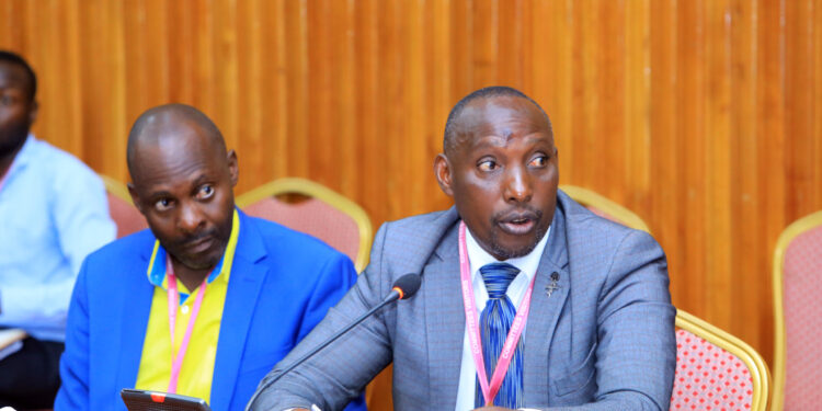 Mayors, Robert Kakyebezi (Mbarara City/left) and Sentaro Byamugisha (Kabale Municipality) appearing before the House Committee on Physical Infrastructure on Tuesday 12 December 2023