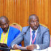 Mayors, Robert Kakyebezi (Mbarara City/left) and Sentaro Byamugisha (Kabale Municipality) appearing before the House Committee on Physical Infrastructure on Tuesday 12 December 2023