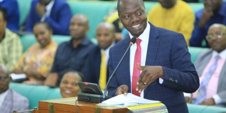 Hon. Robert Migadde presenting the Committee Report to the House on Wednesday 13 December 2023