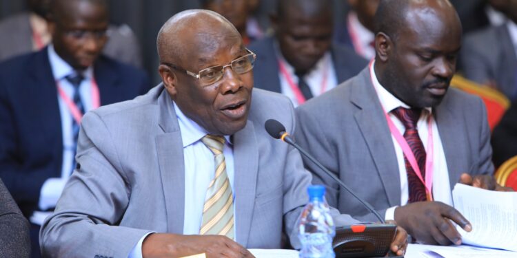 The Minister of State for Energy, Hon. Sidronious Okaasai (left)