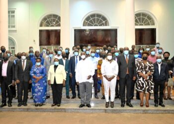 President Museveni in a   group photo with some members of the media after the engagement