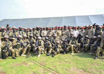 Commander Special Forces Command Brig. Gen. David Mugisha in a group photo with SFC commandos after a debrief of the successful operations for the NAM and the G77+China summit that Uganda hosted in in January, this was at the Sera-Kasenyi Training School on the 27th January 2024. Photo by PPU/Tony Rujuta.