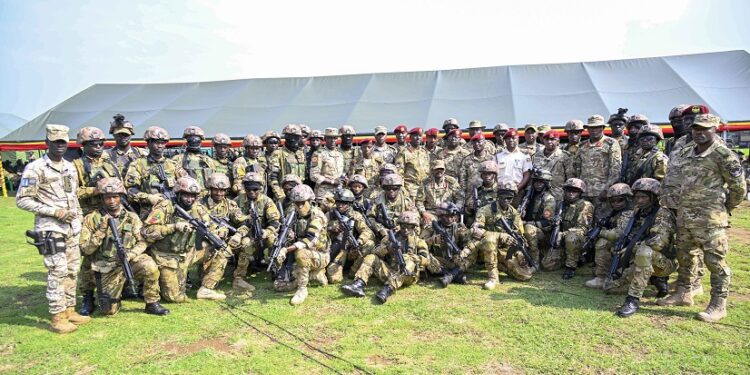 Commander Special Forces Command Brig. Gen. David Mugisha in a group photo with SFC commandos after a debrief of the successful operations for the NAM and the G77+China summit that Uganda hosted in in January, this was at the Sera-Kasenyi Training School on the 27th January 2024. Photo by PPU/Tony Rujuta.