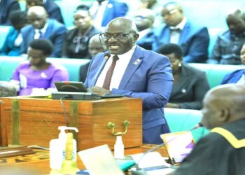 Gen. Katumba Wamala tabling the aviation Bill for First Reading. The minister is counting on MPs to avert the looming crisis